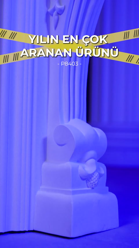 White decorative fireplace foot displayed indoors with blue illumination.