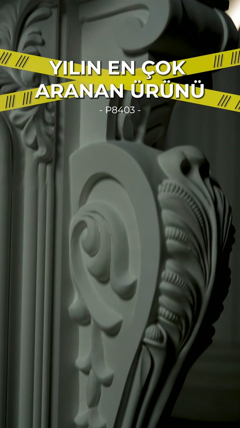 Spiral embossment and ribbed leaf sequence visible along decorative fireplace edge.