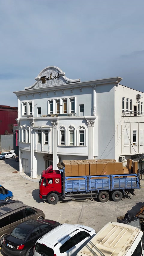 Finished facade moldings frame the windows of the company building.