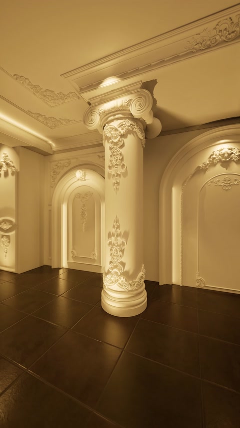 Finished room features ornate columns, arches, cornices, and ceiling decoration.
