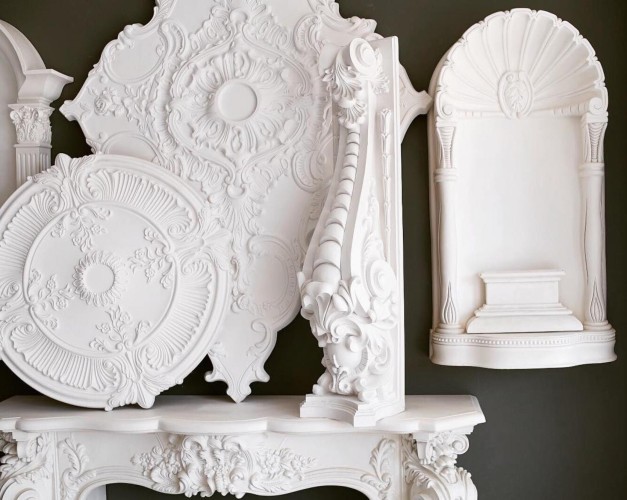 Elegant polyurethane classical decorations with rosettes, niches, and ornate ceiling details <h2>Classical Polyurethane Decoration</h2><p>Polyurethane decoration offers a refined way to introduce <strong>elegance</strong> into interiors, balancing ornate craftsmanship with practicality. The pieces shown feature large circular <strong>rosettes</strong> with radiating sun motifs, surrounded by delicate floral engravings that recall the grandeur of classical architecture. Each detail, from scrolling foliage to the beaded borders, demonstrates the precision possible with polyurethane molding.</p><p>The niches display shell-shaped crowns and fluted side panels, providing both ornamental and functional dimension to walls. The carved volutes, resembling Ionic or Corinthian capitals, bring historical depth to modern settings. In fact, rosettes and acanthus leaf motifs have been staples in European interior design since the Renaissance, where such decorations were valued for their symbolic and ornamental roles.</p><h2>Geometric Harmony and Composition</h2><p>The intricate <strong>motifs</strong> rely on symmetry and layering of ornamental patterns. Circular medallions form focal points on ceilings, while rectangular niches emphasize verticality. The floral and shell-like engravings enhance the rhythm of curved lines, uniting geometry with organic detail. This balance of straight planes and curved scrolls makes polyurethane decoration especially beloved for classical-style interiors.</p><p>Beyond aesthetics, these elements are lightweight and durable, making them easier to install than traditional plaster. The smooth white finish allows either a natural classical look or further customization with paint and gilding. Carefully positioned, these decorations transform plain architectural surfaces into expressions of <strong>craftsmanship</strong> and tradition.</p><ul><li>Floral and acanthus-inspired carving</li><li>Shell-shaped niche crowns</li><li>Radiating rosette medallions</li><li>Symmetrical geometric composition</li><li>Durable and lightweight material</li></ul>

<p>Polyurethane classical decoration offers timeless sophistication for interior spaces. Large rosettes with radiating details add elegance to ceilings. Delicate floral motifs bring softness and charm. Niches with shell crowns provide classical vertical emphasis. Carved volutes resemble ancient capitals with grace. Decorative geometry creates harmonious symmetry. The white color enhances refined details clearly. Lightweight construction makes installation practical. Durable surfaces ensure long-lasting appeal. Strong relief carving adds depth and contrast. Organic patterns balance linear structures beautifully. Historical influences enrich interior design naturally. These ornaments integrate seamlessly with classic or modern styles. Balanced ornamentation evokes cultural continuity. Polyurethane decoration elevates spaces with lasting <strong>elegance</strong>, detailed <strong>rosettes</strong>, and artistic <strong>motifs</strong>.</p>