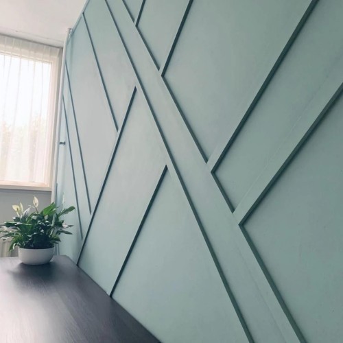 Modern Classic Villa Interior with Geometric Polyurethane Decorative Wall Molding <h2>Modern Classic Villa Wall Design</h2><p>The use of polyurethane decorative wall molding presents a unique opportunity for balancing elegance and minimalism. The wall panels rely on <strong>geometric</strong> forms consisting of intersecting diagonal lines that create rhythm, depth, and a sense of movement. This design approach allows modern interiors to feel dynamic while still retaining a refined, classic appearance.</p><p>The chosen pastel tone of light green enhances brightness and freshness, giving the room a calm yet invigorating energy. Paired with natural daylight, the texture of the <strong>polyurethane</strong> material softly casts shadows that further emphasize the linear patterns, making the wall an architectural statement rather than a mere background surface.</p><h2>Historical and Aesthetic Context</h2><p>Decorative wall elements have a long history in interiors, first seen in classical European villas where ornamental trims highlighted prestige. Unlike heavy plaster, today’s polyurethane is lightweight and durable, allowing intricate composition at a more practical level. The technique merges old-world charm with contemporary simplicity.</p><h2>Design Applications</h2><p>Such patterns can be used in living rooms, hallways, or studies to highlight a feature wall. Their compatibility with natural wood and stone finishes makes them versatile. A subtle integration with plants or textiles helps soften the strong <strong>linear</strong> presence and build a welcoming mood.</p><ul><li>Durable and adaptable <strong>polyurethane</strong> molding</li><li>Geometric rhythm using angled lines</li><li>Pastel green enhancing light and airiness</li><li>Fusion of modern and <strong>classic</strong> styles</li></ul><p>This composition offers homeowners a refined blend of tradition and modernity while introducing artistic identity in daily spaces.</p>

<p>The interior design integrates <strong>polyurethane</strong> wall molding with clean geometry. The diagonal lines create a rhythmic <strong>geometric</strong> effect. Light pastel green adds depth to the surface. Natural light enhances the clarity of the design. The wall becomes an architectural focal point. The <strong>linear</strong> patterns establish structure and balance. Indoor plants soften the graphic feel. The fusion of modern and <strong>classic</strong> design adds timeless style. Polyurethane offers durability and lightness. The aesthetic recalls historical wall decoration in villas. Clean symmetry is avoided in favor of dynamic diagonals. The interplay between shadow and color heightens dimension. The material suits both elegant and practical interiors. Decorative panels emphasize harmony with furniture. Such a wall design elevates any modern-classic villa space.</p>