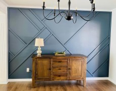 Modern Classic Accent Wall with Asymmetric Polyurethane Trim Modern Classic Wall ConceptThe use of polyurethane trim in asymmetric patterns on a deep blue wall establishes a bold and