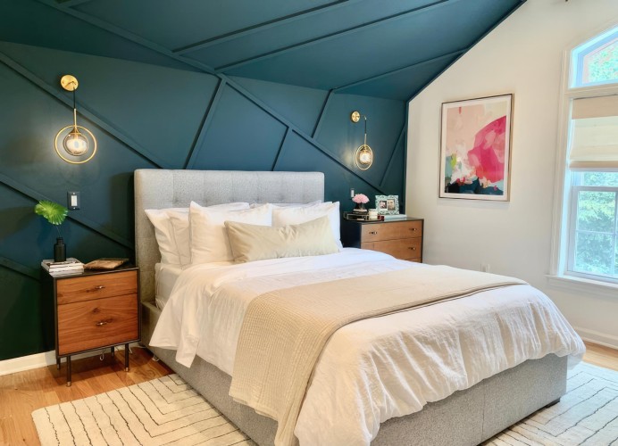 Modern Classic Bedroom with Geometric Polyurethane Molding <h2>Modern Classic Style with Geometric Detailing</h2><p>This bedroom design captures the harmony between modernity and classical calm through the use of <strong>geometric molding</strong> on the accent wall. The teal wall incorporates polyurethane elements structured into diagonal and angular patterns, producing a three-dimensional rhythm that energizes the space without feeling overwhelming.</p><p>The bed, upholstered in soft gray fabric, evokes timeless comfort while layering white and beige bedding adds visual depth. The presence of natural wood nightstands introduces warmth, balanced by golden pendant lights that reflect a refined <strong>modern classic</strong> ambiance.</p><h2>Textures and Composition</h2><p>The choice of polyurethane for the wall detailing allows for clean, sharp lines and durable finishes, complementing the understated textiles used throughout the room. The rug under the bed reflects a subtle linear pattern, resonating with the wall’s angular geometry, thereby linking floor and wall through consistent <strong>design</strong> elements.</p><h2>Subtle Artistic Touches</h2><p>Accents like abstract artwork framed against the white wall bring playful color contrast and soften the bold teal geometry. Historically, decorative wall moldings evolved from classical Greek and Roman interiors, and this design reinterprets them through a modern lens by using asymmetrical patterns rather than ornate flourishes. The combination of clean geometry, classic textures, and thoughtful lighting makes this a space balanced between innovation and coziness.</p>

<p>This modern classic bedroom blends rich color with structured geometry. The accent wall uses <strong>polyurethane</strong> molding to create crisp lines. A bold teal backdrop gives depth and contrast. A soft gray upholstered bed anchors the space. Layered white and beige bedding enhances serenity. The <strong>geometric</strong> rug mirrors linear wall designs. Warm wood nightstands balance contemporary sharpness. Gold pendant lights add elegance with subtle glow. Abstract artwork introduces dynamic color. The combination of modern edges and classic materials feels balanced. The design merges style with long-term comfort. <strong>Symmetry</strong> and asymmetry coexist naturally here. Clean detailing ensures timeless quality. Decorative reliefs link classical history to modern taste. This interior speaks to both practicality and artistry.</p>