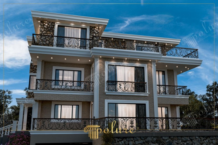 Poliüretan Modernizmin İzleriyle Dış Modern Klasik Villa Tasarımları <h2>Modern ve Klasik Unsurların Birleşimi</h2><p>Poliüretan kullanılarak tasarlanan bu villa, modern ve klasik mimari çizgilerin uyumlu bir sentezini sunuyor. Cephedeki doğal taş uygulamaları, masif görünen ama hafif ve dayanıklı olan <strong>poliüretan</strong> kaplamalarla birleşiyor. Üç katlı yapı, geniş pencereleri ve balkonlarıyla ferah bir yaşam alanı sağlıyor.</p><p>Estetik görsellik kadar fonksiyonelliğe de önem verilen bu tarzda, balkon korkuluklarının zarif <strong>ferforje</strong> desenleri klasik şıklığı modern çizgilerle harmanlıyor. Poliüretan malzemenin sunduğu esneklik, farklı süsleme ve profil detaylarının uygulanmasına olanak veriyor.</p><h2>Detaylarda Zarafet</h2><p>Tavan altlarında LED aydınlatmaların eşlik ettiği dekoratif çıkmalar, yapıya modern bir cazibe katıyor. Klasik sütun formundaki öğeler, Akdeniz ve Avrupa mimarisinden ilham alınarak çağdaş yorumlarla yeniden şekillendirilmiş. Tarihte özellikle İyonik ve Korint sütun düzenlerinin dekoratif amaçlarla sıklıkla kullanılması, bu tip modern projelerde zamansız bir estetik referans sağlar.</p><ul><li>Doğal taş ve tuğla görünümlü panellerin birleşimi</li><li>Geniş cepheli cam pencereler</li><li>Zarif ferforje balkon korkulukları</li><li>Poliüretan kolon ve çerçeve detayları</li></ul><p>Bu dekoratif villa modeli, modern şehir yaşamına uyum sağlayabilecek şekilde tasarlanırken aynı zamanda klasik detayları koruyarak öne çıkıyor. Özellikle dış cephede görülen <strong>estetik bütünlük</strong>, tasarımın ilham kaynağını daha da belirginleştiriyor.</p><h2>Yaşam Alanlarına Katkı</h2><p>Modern klasik villa dekorasyon modelleri, hem konforlu hem görsel açıdan dengeli yaşam alanları yaratıyor. Bu tür yapılar, çağdaş yaşamın beklentilerini karşılayan işlevsellik ile geçmişin zarif hatlarını bir araya getiriyor. Sonuçta ortaya çıkan tasarımlar, mimaride <strong>yenilikçi çözümler</strong> ve kalıcı değerler sunuyor.</p>

<p>Bu villa tasarımı, modern ve klasik öğelerin bir araya getirilmesiyle dikkat çekici bir estetik sunar. Cephe kaplamalarında kullanılan <strong>poliüretan</strong>, dayanıklı ve hafif bir çözüm olarak öne çıkar. Ferforje balkon korkulukları yapıya zarif bir karakter kazandırır. Üç katlı düzen, geniş cam yüzeyleriyle ferah bir iç mekan hissi oluşturur. Dış cephede doğal taş detaylarının kullanımı güçlü bir görsellik sağlar. Sütun formlarındaki dekoratif alanlar klasik tarzın izlerini modern tasarıma taşır. LED aydınlatmalar gece görünümünü etkileyici hale getirir. Doğa ile uyumlu konumu, sakin ve huzurlu bir yaşam önerir. Tuğla dokulu yüzeyler yapıya sıcak bir karakter ekler. Balkon çıkmaları, estetik bütünlüğü belirginleştirir. Tarihsel referanslar, projeye kültürel zenginlik katar. Poliüretan detaylar farklı dekoratif çözümler için geniş imkanlar sunar. Fonksiyonellik ve estetik bir arada ele alınır. Villa formu, şehir yaşamında modern bir alternatif oluşturur. Böylece çağdaş tasarım ile <strong>klasik zarafet</strong> dengeli bir uyum yakalar.</p>