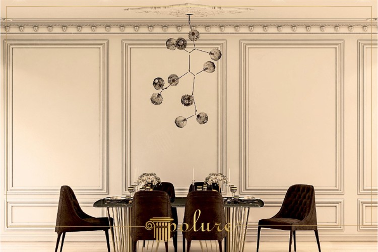 Modern Classic Wall Moulding with Polyurethane for Elegant Interiors <h2>Modern Classic Wall Design with Polyurethane Panels</h2><p>In contemporary interiors, <strong>polyurethane</strong> has become a preferred material for wall moulding due to its durability, lightweight structure, and ease of application. The wall panels in this design are carefully composed with large rectangular frames bordered by refined step profiles, providing a sense of balance and proportion typical of <strong>classical</strong> architecture.</p><p>The delicate shadow play created by the raised frames enhances the surface, turning it into an elegant backdrop for a dining area. This form of <strong>wall moulding</strong> reflects historic influences from neoclassical design, where symmetry and proportionality were key aesthetic principles.</p><p>At the center of the composition, the chandelier introduces a geometric twist with interconnected spherical forms, contrasting with the precise linear borders of the wall trims. This juxtaposition epitomizes the essence of <strong>modern classic</strong> interiors, blending traditional motifs with experimental shapes.</p><p>The dining furniture emphasizes luxury with deep brown upholstery and subtle vertical tufting, while the table integrates golden vertical rods, harmonizing with the ornate yet restrained decor. The combination of textures, from smooth polished wood to metallic accents, complements the polyurethane framing details.</p><h2>Geometric and Ornamental Harmony</h2><p>The layered borders resemble architectural motifs that historically originated from the moldings of Renaissance and French classical interiors. The linear geometry of the rectangular wall modules ensures a clean rhythm, while the ornamental depth of the carvings reflects timeless craftsmanship.</p><p>By merging <strong>geometric</strong> form with subtle decorative flourishes, this interior demonstrates how modern spaces can remain sophisticated without excess. The result is a versatile room that conveys elegance, balance, and functionality through polyurethane moulding.</p>

<p>This modern dining room showcases the elegance of <strong>polyurethane</strong> moulding on classic wall panels. The rectangular wall frames add depth and a sense of balance. Each layer of trim is designed to enhance refined proportions. The panels remain neutral in tone, allowing furniture and lighting to stand out. A striking chandelier of spherical geometry balances the classic backdrop. This fusion of styles defines the <strong>modern classic</strong> aesthetic. The chairs, with dark brown velvet, provide warmth and sophistication. Golden vertical rods of the table create a luxurious contrast. The overall composition feels timeless yet contemporary. The room emphasizes ornamental depth and geometric order. Historical inspiration from neoclassical interiors is evident in the framing details. The design ensures the space feels both formal and inviting. Light and shadow enhance the decorative borders. Intricate motifs are paired with clean <strong>geometric</strong> lines. The result is a harmonious and elegant living environment.</p>