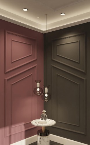 Modern Classic Living Room with Polyurethane Wall Moulding <h2>Polyurethane Wall Moulding in Modern Classic Interiors</h2><p>Polyurethane wall mouldings introduce a refined architectural rhythm into interiors by shaping walls with geometric precision. In this design, the use of <strong>polyurethane</strong> panels with rectangular and diagonal motifs creates visual contrast that enriches the atmosphere of the living room. The matte rose surface adds a modern vibrancy, while the dark taupe section grounds the composition with depth and balance.</p><p>Lighting plays a crucial role in highlighting the contours of the <strong>mouldings</strong>. Recessed ceiling lights and a soft cove glow amplify the relief created by the frames, giving subtle dimension to the otherwise flat surfaces. Suspended pendant luminaires with tinted glass globes introduce a modern sculptural element that complements the classic character of the wall panels.</p><p>The juxtaposition of a marble-topped pedestal table enriches the overall material contrast, combining classical stone with contemporary forms. Polyurethane mouldings, unlike traditional plaster, are lightweight, durable, and especially suited for modern construction needs while retaining the charm of older decorative approaches. Their roots can be traced to the ornamental traditions of neoclassical interiors, yet their adaptability makes them practical for current design demands.</p><ul><li>Contrasting wall colors emphasize structured geometry.</li><li>Pendant lights highlight the moulding textures.</li><li>Marble elements add luxurious balance to the walls.</li></ul><p>Whether applied to large living rooms or accent corners, <strong>polyurethane wall design</strong> ensures longevity while maintaining a sophisticated aesthetic. Its detailed motifs and the interplay of light and shadow make it a favored choice for merging modern and classic styles.</p>

<p>Polyurethane wall moulding brings elegance to a living room with its structured geometry. The sophisticated use of <strong>polyurethane</strong> panels creates textured patterns on plain walls. Contrasting colors such as matte rose and dark taupe deliver visual depth. Integrated lighting highlights every contour of the frames. Suspended glass pendant lights add modern artistic energy. A marble-topped table balances tradition with luxury. The addition of diagonal motifs distinguishes this moulding design. Shadows enhance the <strong>mouldings</strong> and textures dramatically. The combination of smooth geometry and muted tones feels timeless. Classical influence is subtly present in the panel patterns. The durability of polyurethane ensures long-term use. Light reflections bring ambiance to the living room corner. The strong lines of the design feel both modern and classic. Decorative framing works with recessed lighting for elegance. This modern classic fusion makes <strong>interior decoration</strong> stand out.</p>